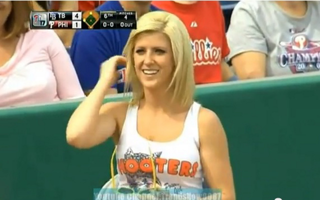 (Video) Hooters ball girl picks up live ball during Baseball game and gives to a fan