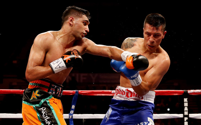 Amir Khan overcomes knockdown to beat Julio Diaz