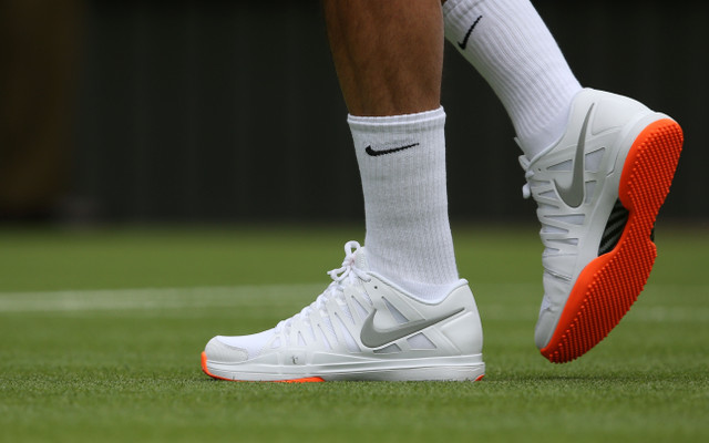 Champion Roger Federer suffers Wimbledon foot fault over orange shoes
